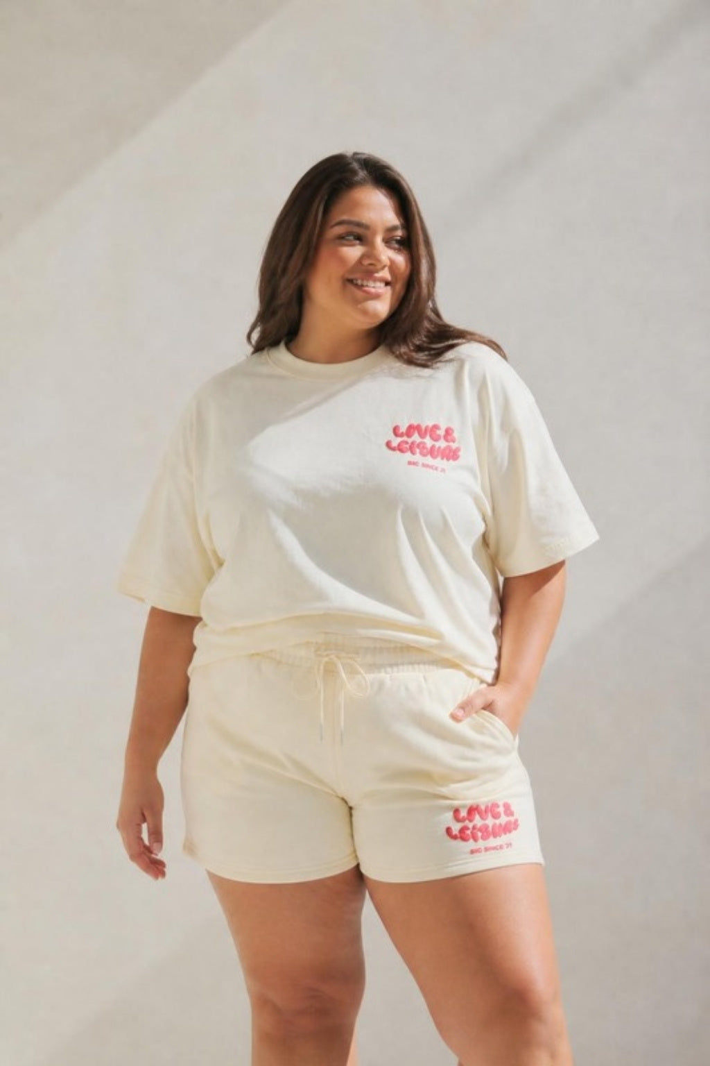 Size 3XL model wearing Love &amp; Leisure Adults Oversized Tee - Cherry Cream