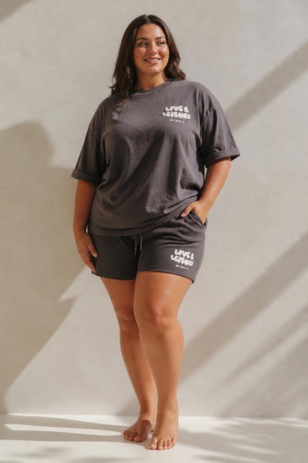 Size 3XL model wearing Love &amp; Leisure Adults Oversized Tee - Moondust