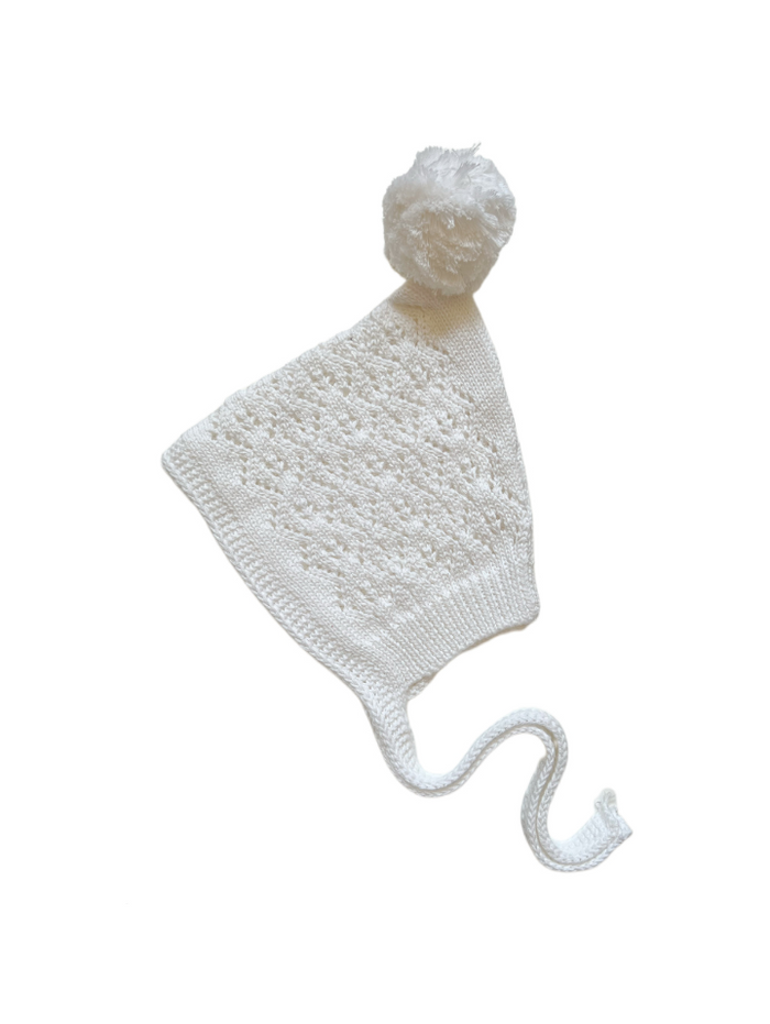 Knitted Pixie Bonnet in White, product shot on a white background