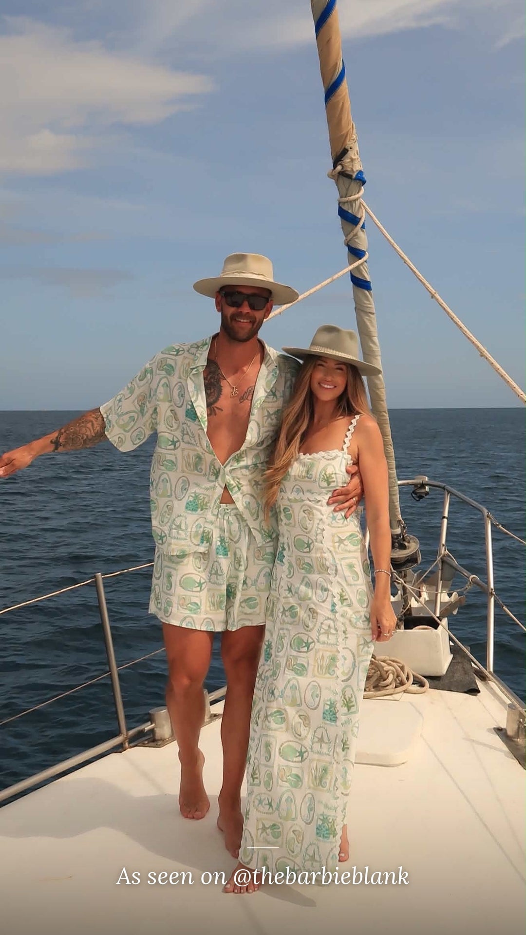As seen on @thebarbieblank – couple wearing the Paradiso linen shirt, shorts and Maya maxi dress on a sailboat