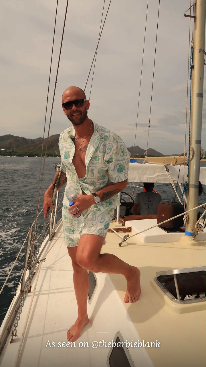 As seen on @thebarbieblank – man wearing the Paradiso linen shirt and shorts set on a sailboat